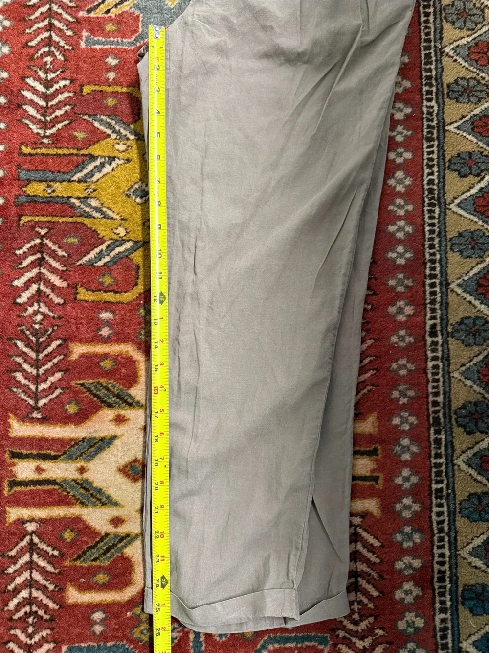 AllSaints trousers with a pleated front and a button closure